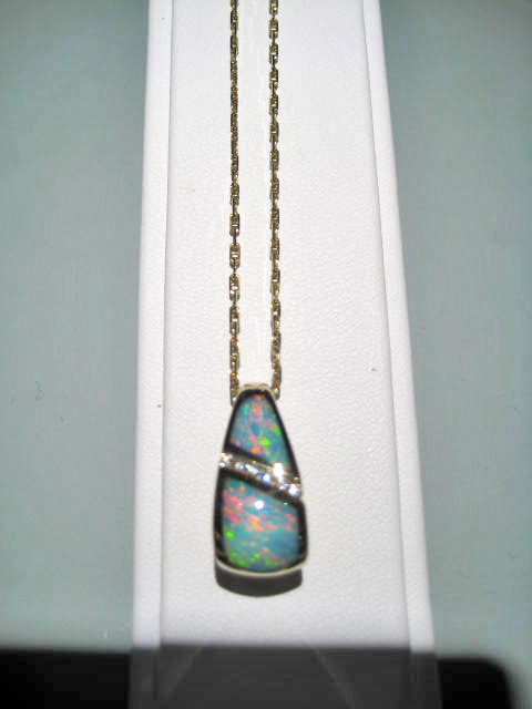 14K Gold Pendant and Chain with Opal and Diamond Artist: Kabana Stavros Catalog: 895-24-9 #19314 Price: $2,950.00 REDUCED: $1,500.00