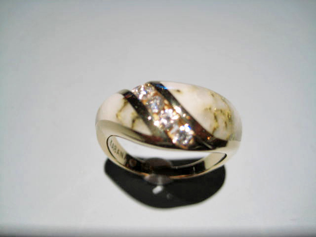 14K Gold Ring with Gold Quartz and .25c Diamond Artist: Kabana Stavros Catalog: 895-66-3 #19336 Price: $2,500.00 REDUCED: $1,200.00
