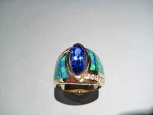 14K Gold Ring with Opal, Tanzanite, and .35c Diamond Artist: Kabana Stavros Catalog: 800-30-8 #18785 Price: $9,750.00 REDUCED: $4,950.00