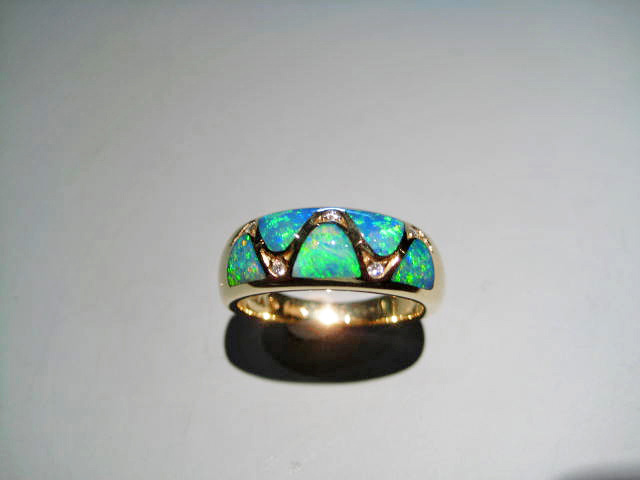 14K Gold Ring with Opal and .05c Diamond Artist: Kabana Stavros Catalog: 895-27-8