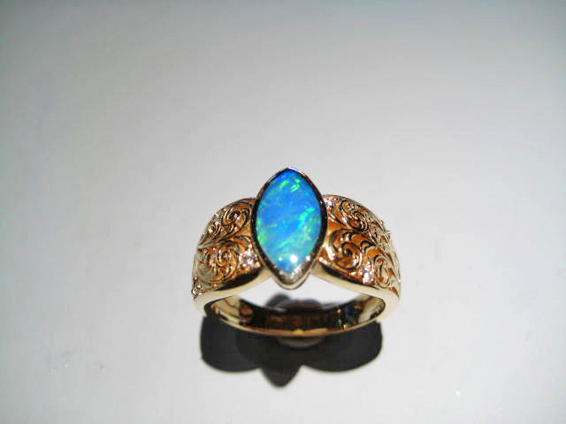 14K Gold Ring with Opal and .09c Diamond Artist: Kabana Stavros Catalog: 895-09-0 #18879 Price: $1,750.00 REDUCED: $995.00