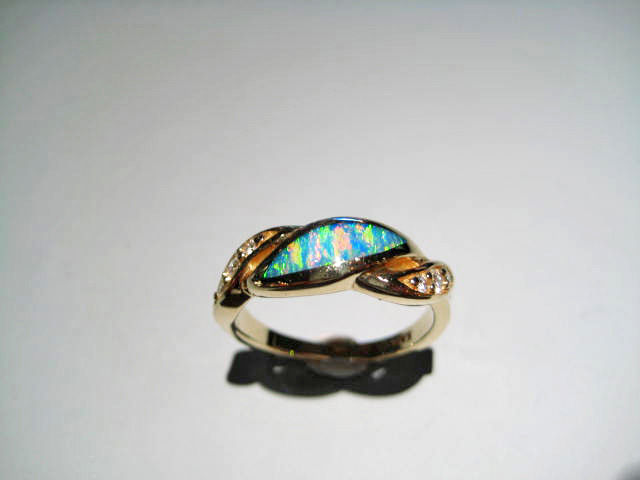 14K Gold Ring with Opal and .11c Diamond Artist: Kabana Stavros Catalog: 895-26-5 #18936 Price: $1,650.00 REDUCED: $990.00